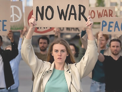 Young individuals actively engaging in an anti-war protest, united in their commitment to advocate for peace and oppose conflict
