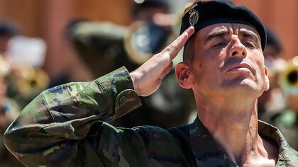 Spanish soldiers from the Brigada Paracaidista salute during the retirement ceremony for Lt. Gen. Cesar Muro, held as part of Operation Skyfall in Madrid, Spain, on May 6, 2015