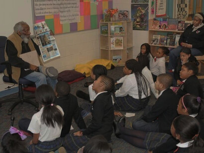 Speaker and actor Dick Gregory visit Bluford. Photo courtesy of Universal Companies