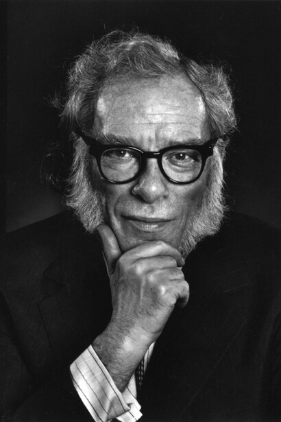 An American writer and biochemistry professor at Boston University, Isaac Asimov was a central figure in science fiction. As one of the “Big Three,” together with Robert A. Heinlein and Arthur C. Clarke, he produced an extraordinary body of work, writing or editing over 500 books