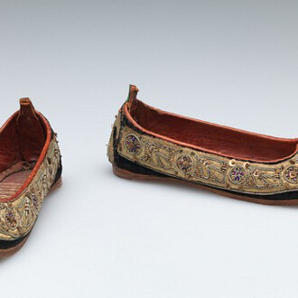 Unknown artist, Indian, Child’s shoes (juttis), late 19th Century, Silk velvet with metallic thread, metal sequin, and stamped metal embellishment, trimmed with leather, Length: 16.5 cm (6 1/2 inches) Gift of Nelson A., Laurence S. and David Rockefeller 56.068
