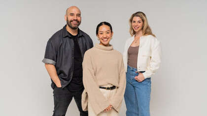 Stanley Henry, CEO and Co-Founder of The Attention Seeker, Jony Lee, Strategist at The Attentions Seeker, and Claire Wallace, Co-Founder of the Attention Seeker, stand alongside each other proudly, reflecting the strong leadership at the helm of the growing and innovative company