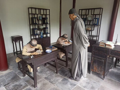 How Zhou was formally taught at his residence. The long braided "queue" which was a mandatory hairstyle during the Qing Dynasty, China