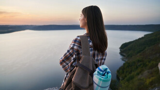 A traveler pauses to soak in stillness, embracing the essence of slow travel 