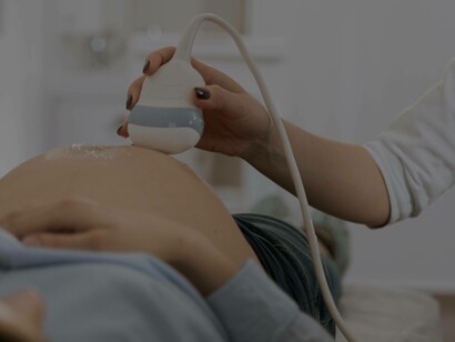 A doctor running an ultrasound scan