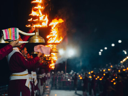 The sacred sounds of the Ganga Aarti ceremony resonate at sunset along the Ganges in Varanasi, India