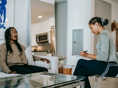 A psychologist taking notes during an appointment