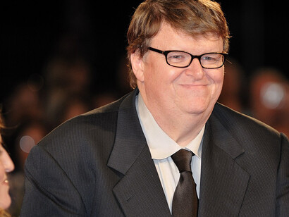 Michael Moore walks the red carpet for his film Capitalism: A Love Story, which is in competition