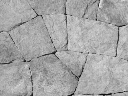 The foundation cracks, a close up of broken stones reminds us that even in pieces there is strength 