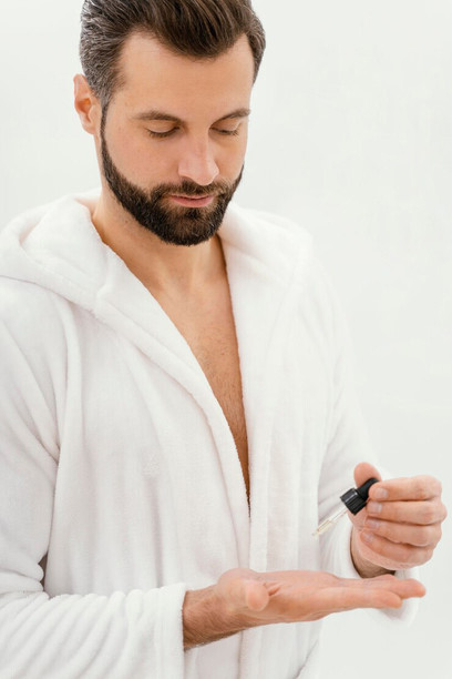 Men embracing skincare routines and self-care products as part of popular social media beauty trends
