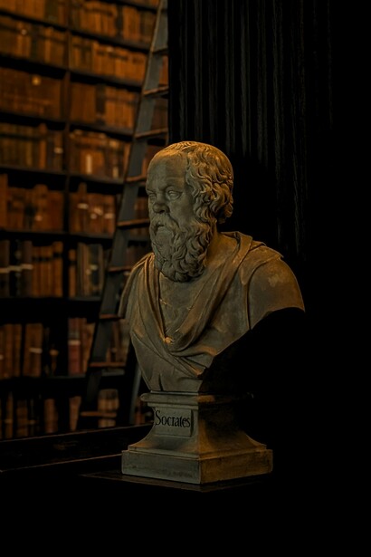 A statue of Socrates framed by shelves of books, reflecting the centuries-old pursuit of knowledge through written works
