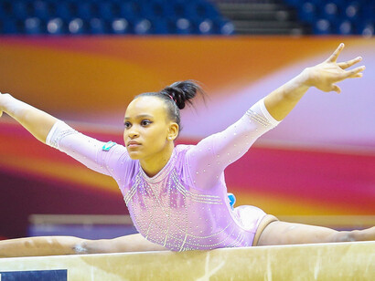 Rebeca Andrade poses on the balance beam at the 2018 Artistic Gymnastics World Championships