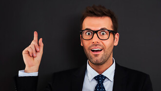 A businessman or CEO, looking happy and calm, has a breakthrough idea
