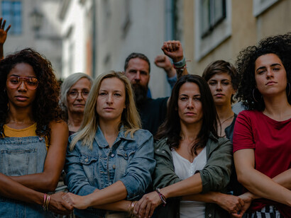 People marching through the streets during a peaceful protest for social justice and women's rights