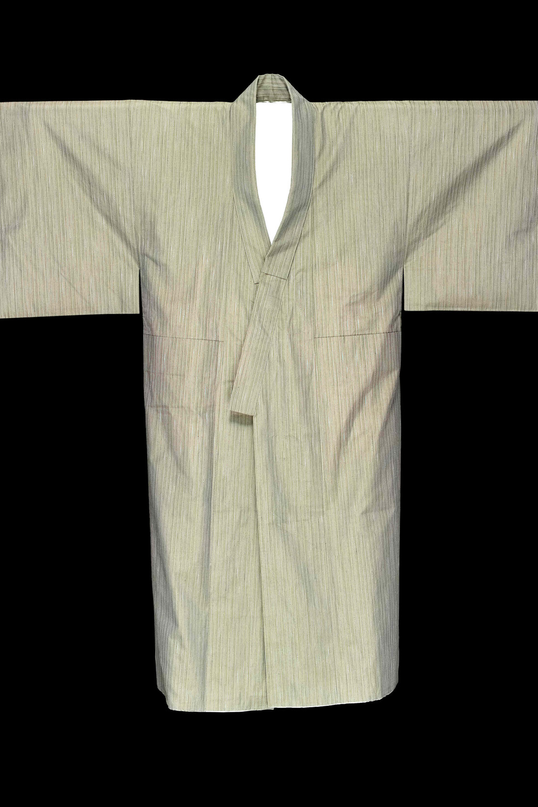 Male kimono. Cotton with a thin line pattern. Lined with silk. It is made from contemporary materials but keeping in mind later 18th century styles. The colour is known as 'Kichisaburo' after Arashi Kichisaburo II (1769-1821), a kabuki actor, who favoured the colour in his clothing. Made in: Japan, 2014. © Given by Isetan Mitsukoshi Holdings Ltd