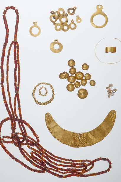 Anatolian
Chalcholithic Jewelry Group
Chalcholithic period, ca. 3400–2700 BC
Gold, carnelian, shells
Pectoral: L. 5 5/8 in. (14.3 cm), W. at center 1 3/16 in. (3.0 cm)
Circular pendants: H. max./min. 1 1/4–9/16 in. (3.1–1.5 cm), W. max./min. 2 5/8–1 1/2 in (2.7–1.2 cm); cylindrical bead necklaces: L. 39 15/16 in.(101.5 cm); 27 1/2 in. (69.9 cm); 32 5/8 in. (82.9 cm)
Sidney and Lois Eskenazi Museum of Art, Burton Y. Berry Collection