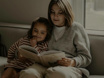 A mother and daughter consumed in a novel in the modern age