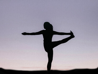Silhouette of a teenager doing yoga