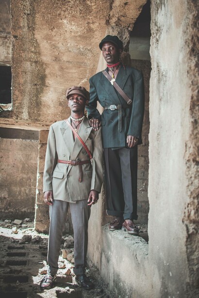 Male models pose in an abandoned building