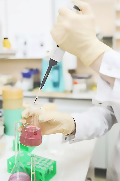 A dedicated scientist diligently conducts research in a state-of-the-art laboratory, tirelessly working towards the development of groundbreaking vaccines for cancer