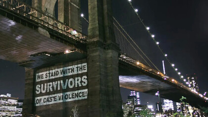 Sign on a bridge standing against caste violence in America