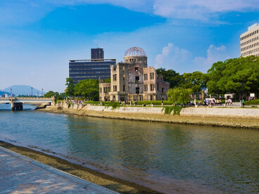 The Hiroshima Atomic Bomb Dome stands along the Aioi River in Hiroshima, Japan