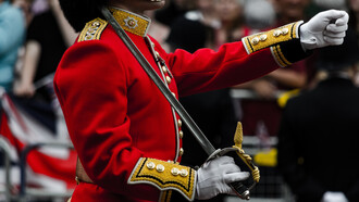 A british royal guard marching on the crowning day of King Charles III