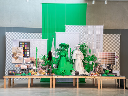 Stephanie Syjuco, detail of “Dodge and Burn (Visible Storage)” from “Stephanie Syjuco: Rogue States” at the Contemporary Art Museum in St. Louis, MO, 2019. Wooden platform, digital photos and printed vinyl on lasercut wood, chromakey fabric, printed backdrops, seamless paper, artificial plants, mixed media. Overall installation: 240 x 204 x 96 inches. Edition of 3 + 2AP. Courtesy of the artist and Catharine Clark Gallery, San Francisco