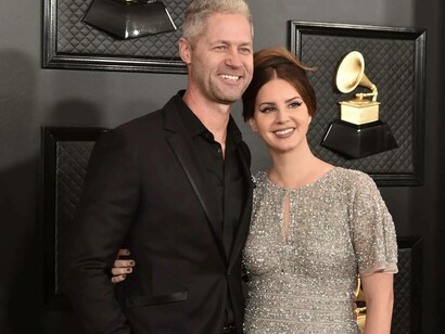 Lana Del Rey smiling with her "Daddy" Sean Larkin as they pose for pictures at the Grammy Awards