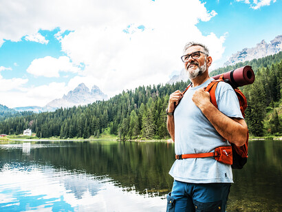 Active older man exploring the mountains on foot, showcasing healthy aging and a love of adventure