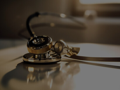 In the foreground, a medical instrument takes center stage atop paperwork, drawing attention to the intricate details and importance of healthcare documentation