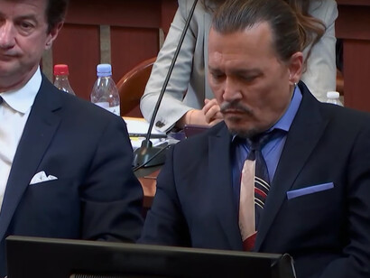Johnny Depp and his attorney Ben Chew in the courtroom at the Fairfax County Circuit Court in Fairfax, Virginia