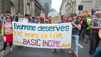 Protesters march for the basic income initiative