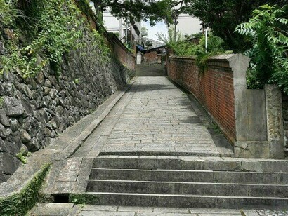 Dutch Slope bordered by stone and brick walls, symbolising the spirit of old Nagasaki