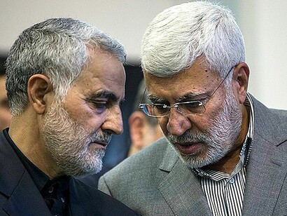 Iraqi militia leader Abu Mahdi al-Mandis and Iranian General Qassem Soleimani