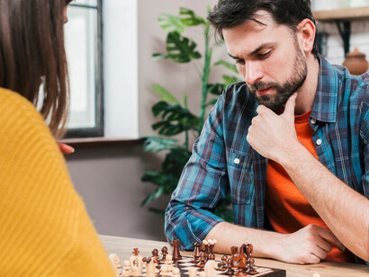 Couple enjoying a strategic chess game at home together
