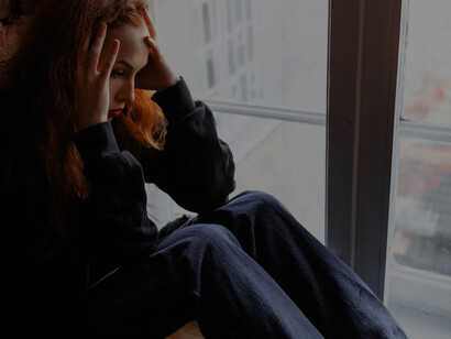 By the window's edge, a girl, wrestling with the weight of depression and anxiety, finds solace in deep contemplation