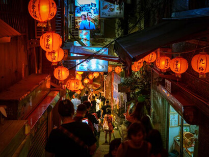 Taiwan's vibrant culture captured through glowing orange pendant lamps under the night sky