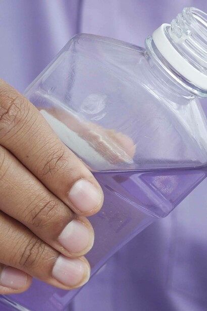 Man holding a bottle of mouth wash