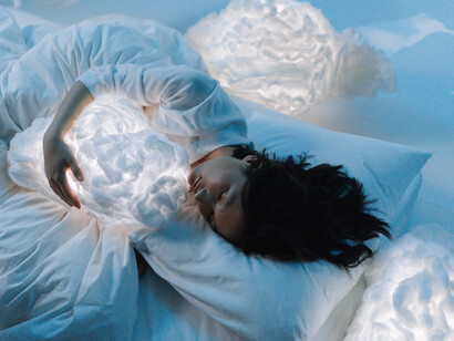 Woman sleeping in the white clouds