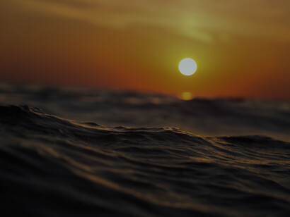A sunset in the middle of the ocean. The series of days and nights crumbling by the side of the bed that leaves a mark of yesterday, of the day which has passed by in years, and of today which will hold your weight to go into tomorrow