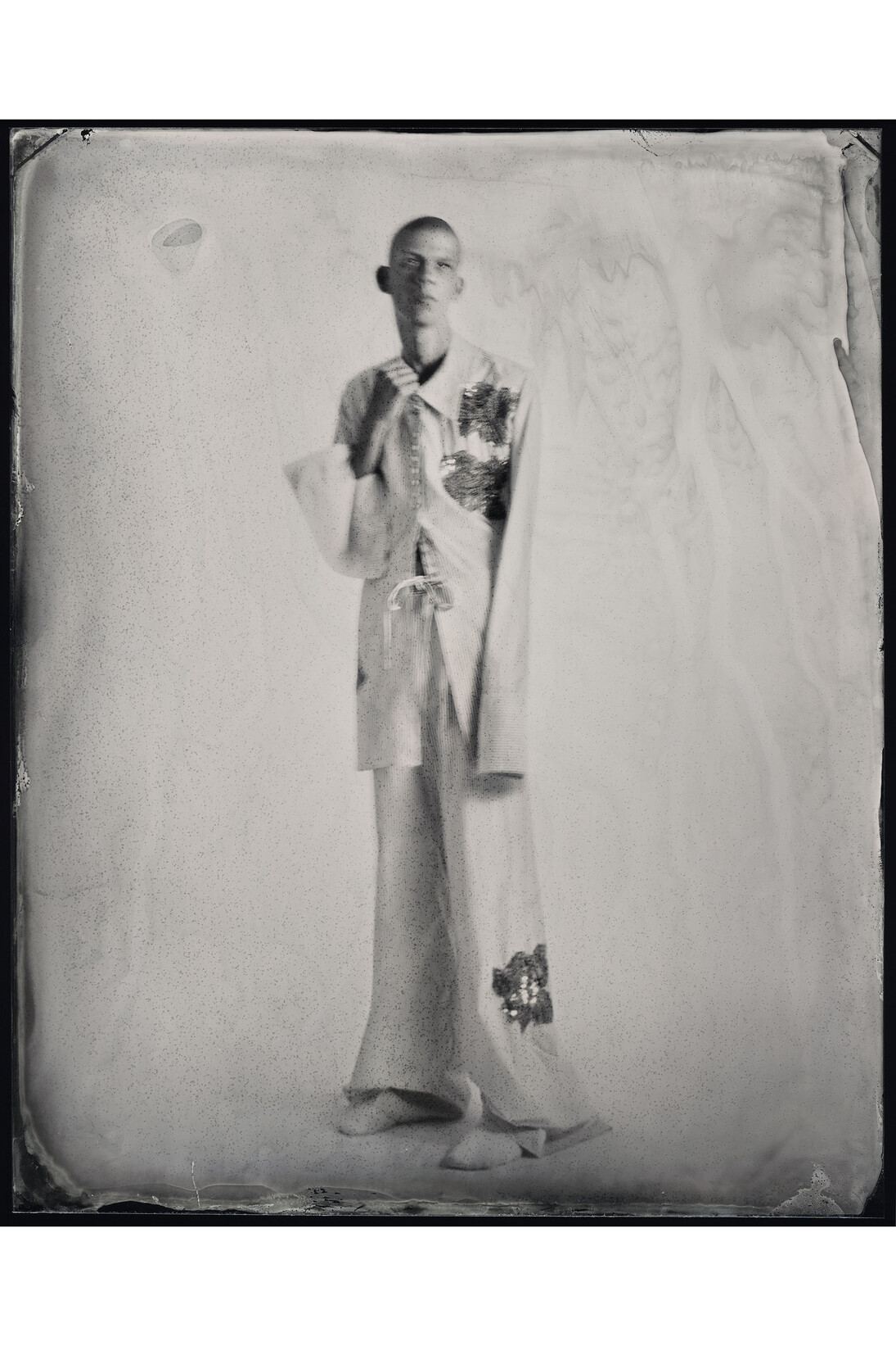 Kasia Wozniak, Wet Plate Collodion Ferrotype, Inspiration from the pages of Sherlock Holmes: “…and for days on end he would lie upon the sofa in the sitting-room …” [A Study in Scarlet, by Arthur Conan Doyle], Fashion credits: Pyjamas: Ed Lee, BA Menswear, Central Saint Martins, 2014, © Kasia Wozniak/Museum of London