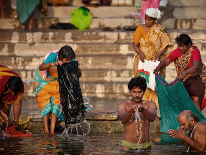Amid extreme temperatures, people in India turn to water to find relief from the heat