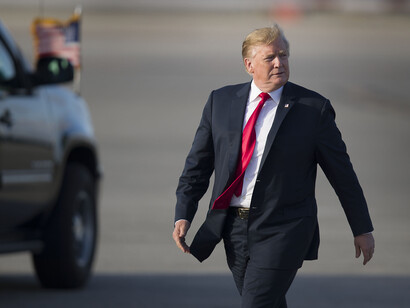 He put a corset over his stomach and lengthened his tie to cover it as much as a tie can