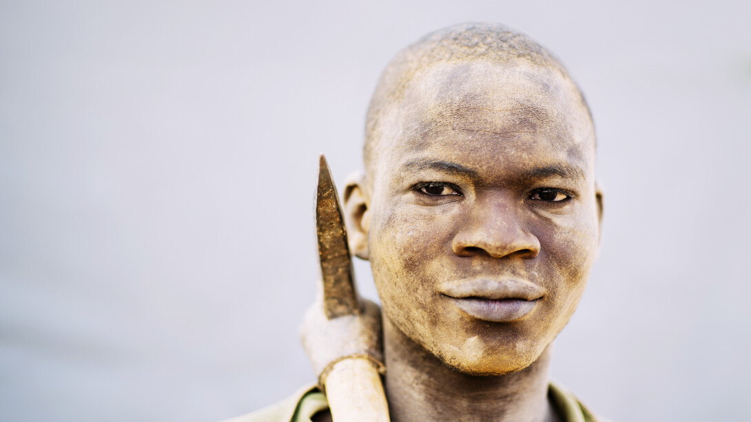 A miner’s face, covered in dirt, tells the story of long hours and hard labour in the pursuit of cobalt for global technology