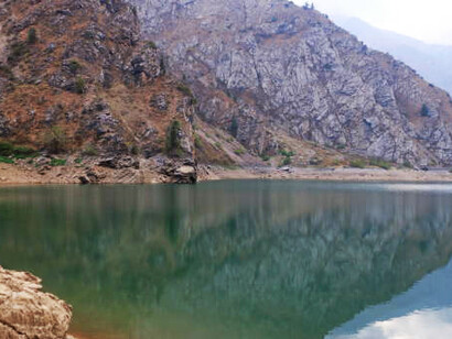Urungach Lake for a breathtaking escape with its pristine waters and picturesque landscape, ideal for hiking and nature photography, Uzbekistan