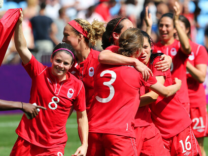 Canada's women's team celebrating bronze at the 2012 Olympics