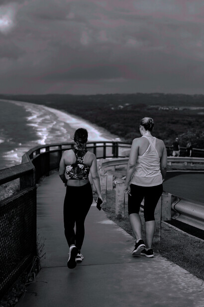 Two women exercising in nature for detox time
