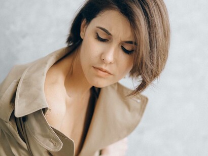 Woman in beige trenchcoat 