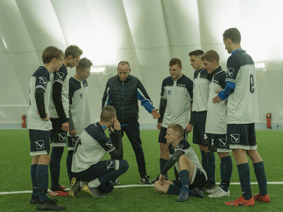 The coach's motivational words resonate with the team, exemplifying how transformational leadership can inspire athletes to reach their full potential